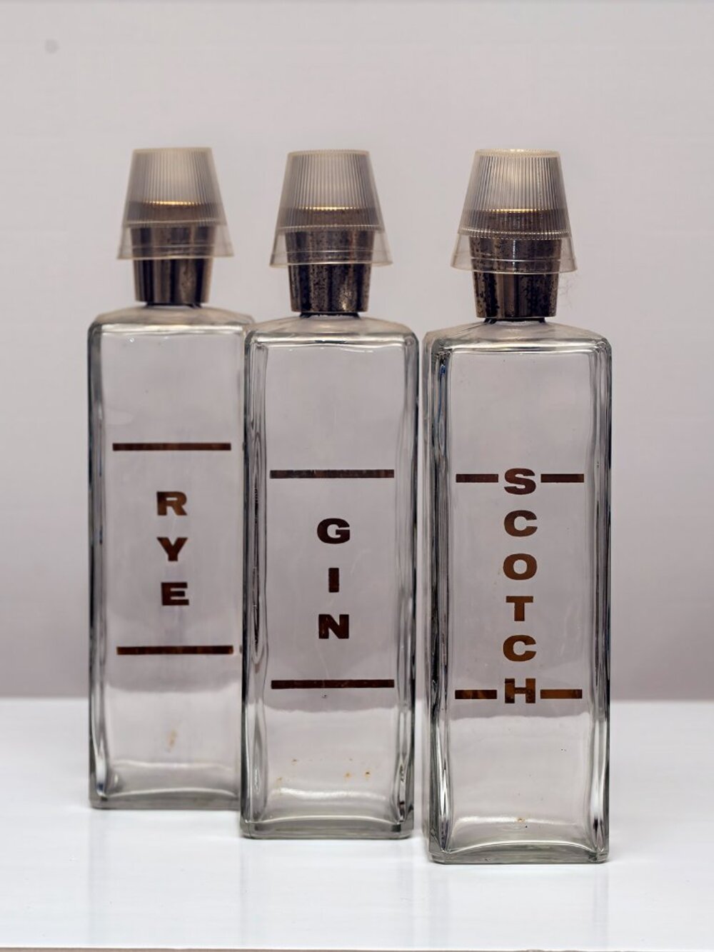 Vintage three-piece bar square bottle set Gin Scotch Rye pourer tops